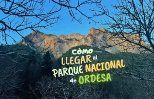 Paisaje montañoso con el texto "Cómo llegar al Parque Nacional de Ordesa".