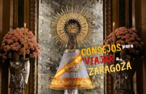 Virgen del Pilar en Zaragoza, con flores, velas y adornos dorados.