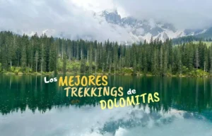 Lago de montaña, bosque, picos Dolomitas y texto 'Mejores Trekkings'.