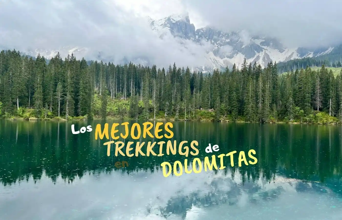 Lago de montaña, bosque, picos Dolomitas y texto 'Mejores Trekkings'.