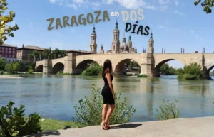Mujer admira Basílica del Pilar y Puente de Piedra, Zaragoza.