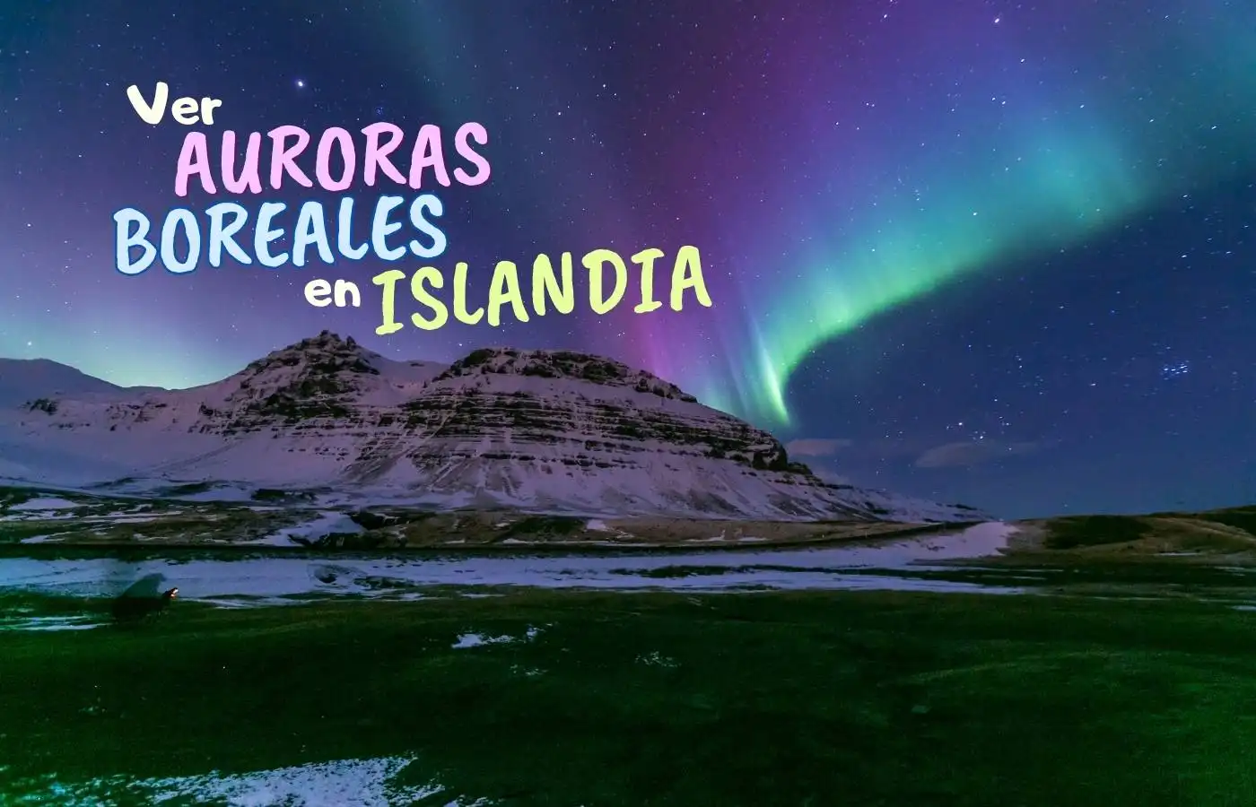 Auroras boreales vibrantes sobre montañas nevadas en Islandia.
